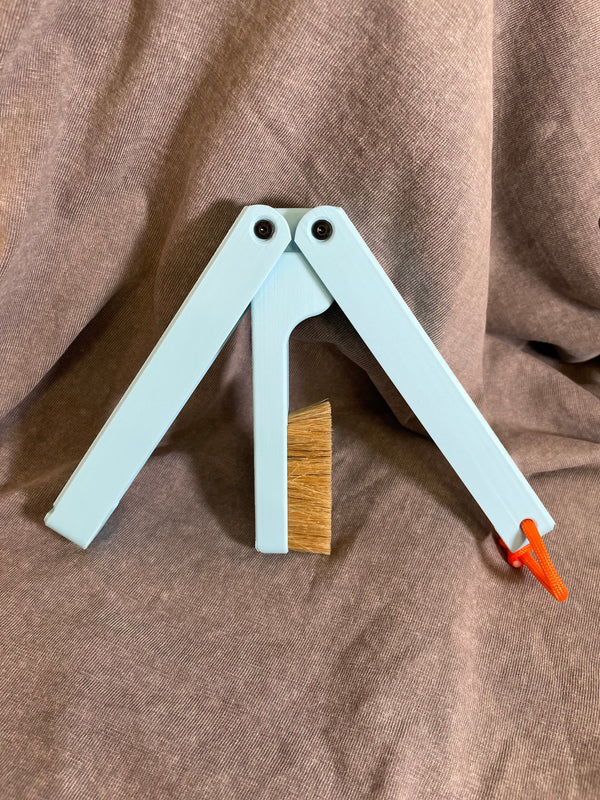 Strength Labs Butterfly Brush — foldable climbing brush in baby blue